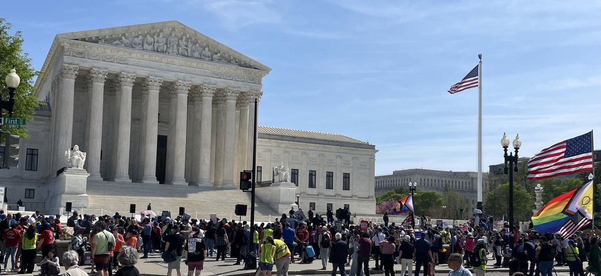 A large crowd of demonstrators with flags and signs gathered outside the U.S. Supreme Court on April 1, 2026